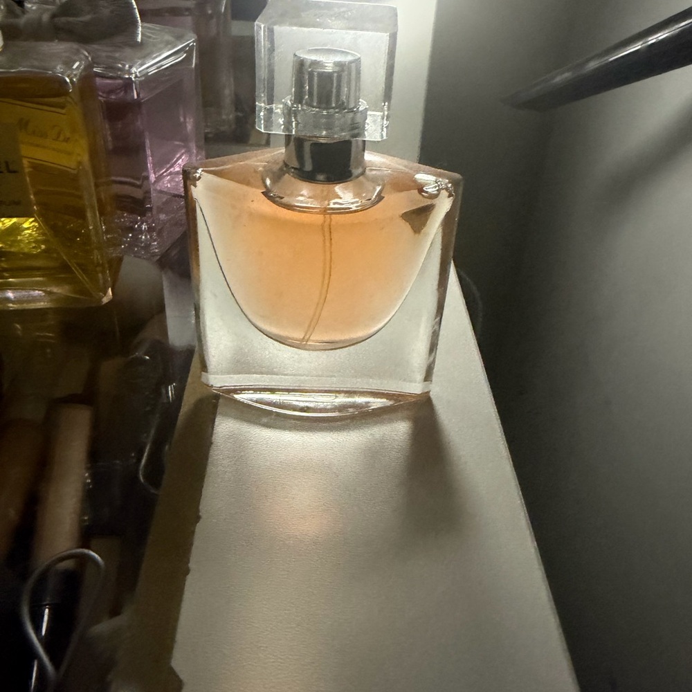 Elegant Perfume Bottle with Pink Hue